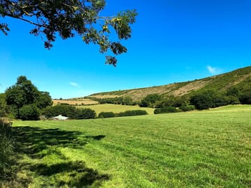 The Purbeck ridge above the pitches stretches to Corfe Castle