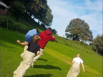 Guests having a potato sack race