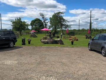 The outside seating area of the farm shop, dog friendly.