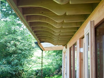 Carved roof overhanging the front deck