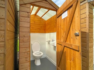Clean flushing toilets with lots of toilet roll, bin and brush. cleaned regularly.