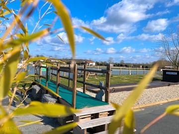 Playground with fishing pond in background