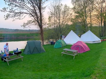 Barbecue and picnic tables by the river