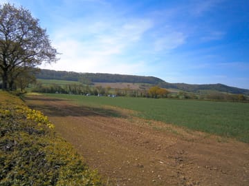 Camping field with wenlock edge behind
