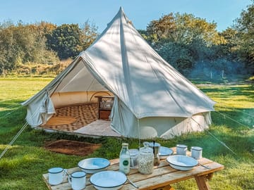 Bell tent and outdoor picnic table