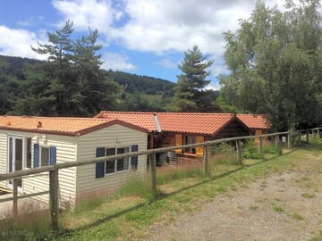Surrounded by trees and with mountain views