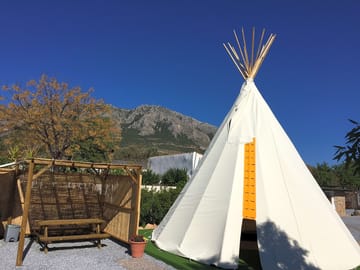 Shaded picnic table by the tipi
