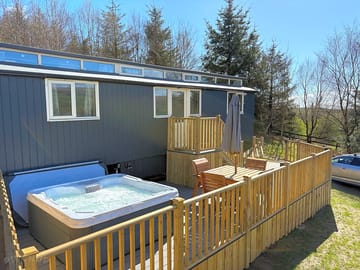 Outdoor space with hot tub