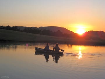 Boating on the lake as the sun sets