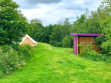 Deluxe bell tent with a private shower and toilet