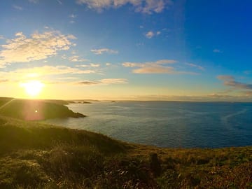View of st brides bay and campsite at sunrise