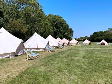 Deckchairs outside the tents