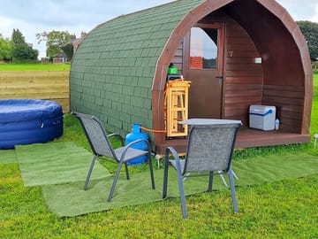 Number 7 pod with it's very own hot tub. the fairy lights at night add that romantic touch.