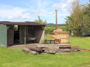 The brazier and wood burning hot tub shared amongst yurt guests