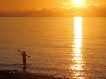 Swimming at sunset