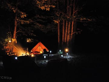The bell tents at night