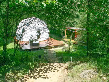 Dome sheltered by trees