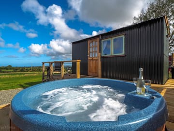 Relax in your own private hot tub and enjoy the views.