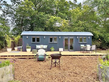 Watch the sun set over the field from this lodge