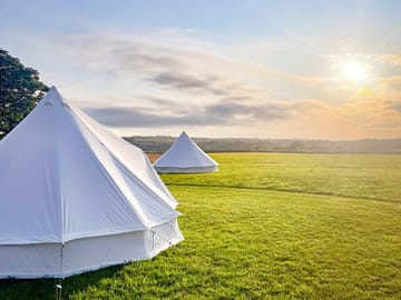 Sunset behind the bell tents