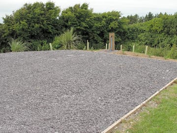 Refurbished pitch 5, hardstanding with water, grey waste drain and electric