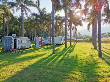 Grassy pitches with a view of Etna