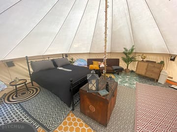 Spacious tent interior with double carpeted flooring for warmth and comfort