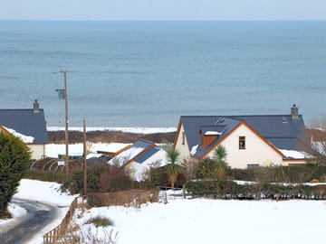 Winter shot of main house and sea