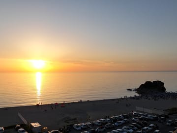 Sunset over the beach in front of the site