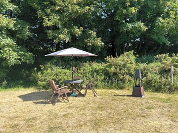 Outdoor seating / dining area next to woodpecker