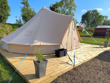 Bell tent includes 1 double bed and 2 single beds