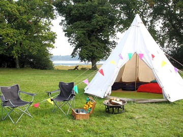 Outdoor seating and bunting with every tent
