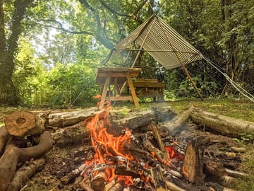 Firepit in front of the camp kitchen