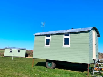 Maple Hut with shower block behind
