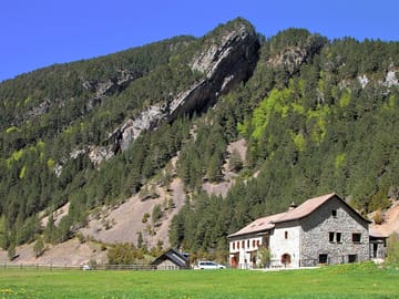 Camping field and mountain refuge