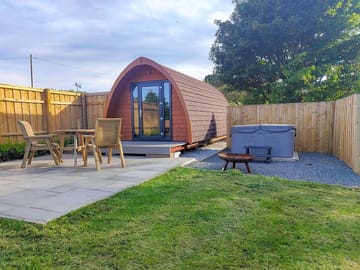 Private garden area with hot tub, seating and barbecue