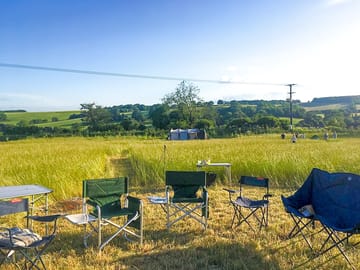 Guests' chairs around a firepit