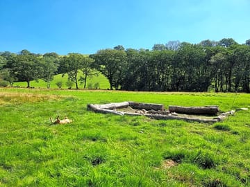 Main camping field with a communal firepit