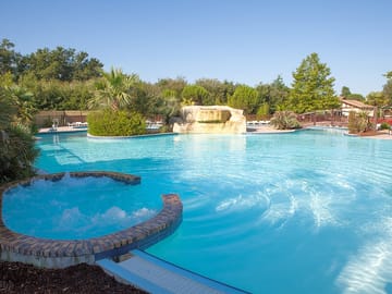 Swimming pool with hot tub