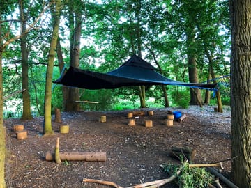 Covered firepit area in the woods