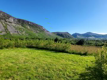 Grass pitch overlooked by gyrn ddu