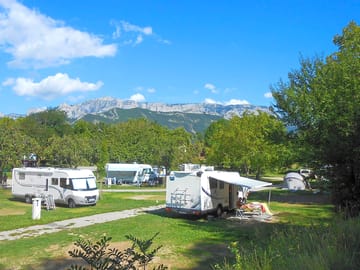 Level grass pitches with mountain views