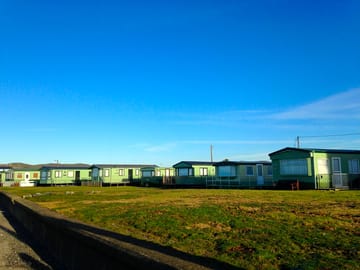 Neptune hall caravan park is situated right on the beach with panoramic views of the cardigan bay.