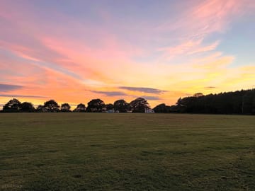 Stunning sunset across the field