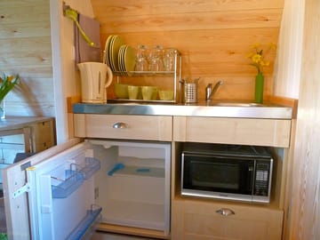 The pod kitchenette comes fully equipped