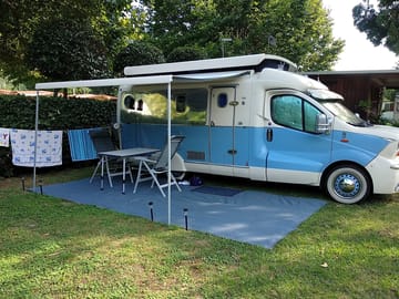 Motorhome pitch on grass and gravel with electricity