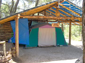 Tent pitch with sun and rain protection