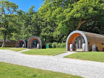 All pods have outdoor seating and a barbecue