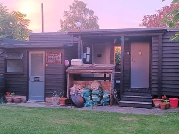 Shower block, honesty shop and communal kitchen.