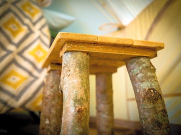 Rustic furniture in the bell tent